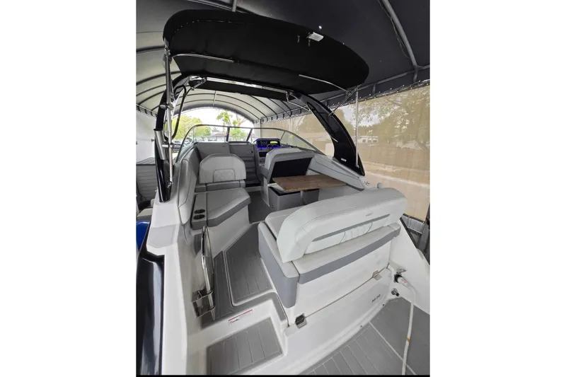 Slide: The Image of 2023 Regal 26 XO boat interior with seating and helm under canopy. - 21