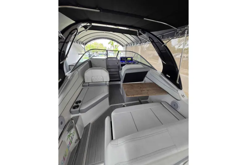 Slide: The Image of Interior of 2023 Regal 26 XO boat with seating and wooden table. - 22