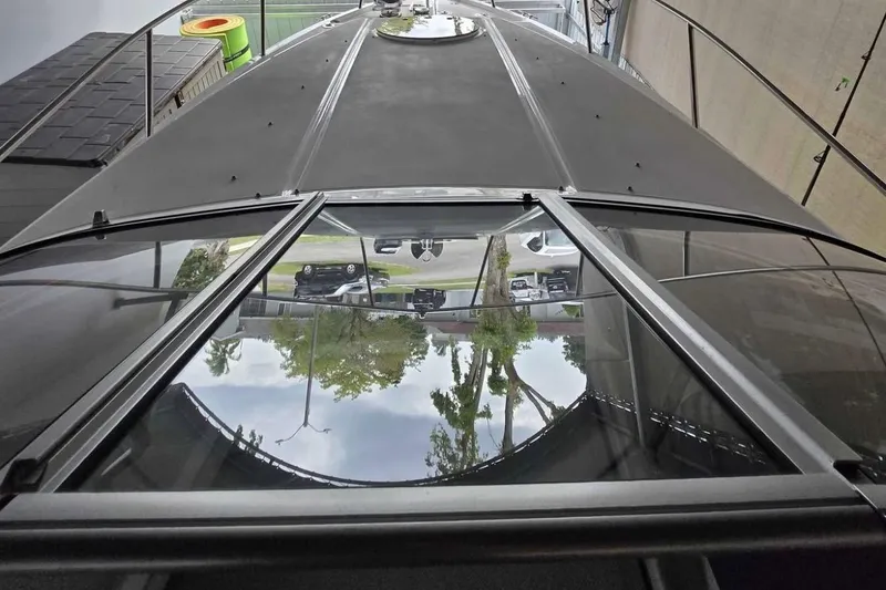 Slide: The Image of 2023 Regal 26 XO boat with sleek design and reflective windows. - 27