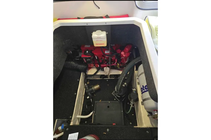 Slide: The Image of Engine compartment of a 2023 Regal 26 XO boat, showcasing mechanical components and wiring. - 31