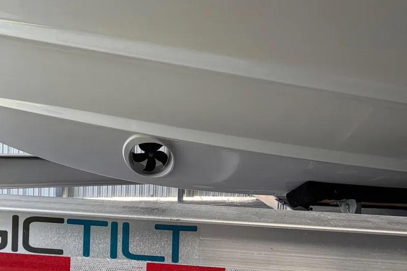 Slide: The Image of 2023 Regal 26 XO boat hull with visible propeller on trailer. - 37