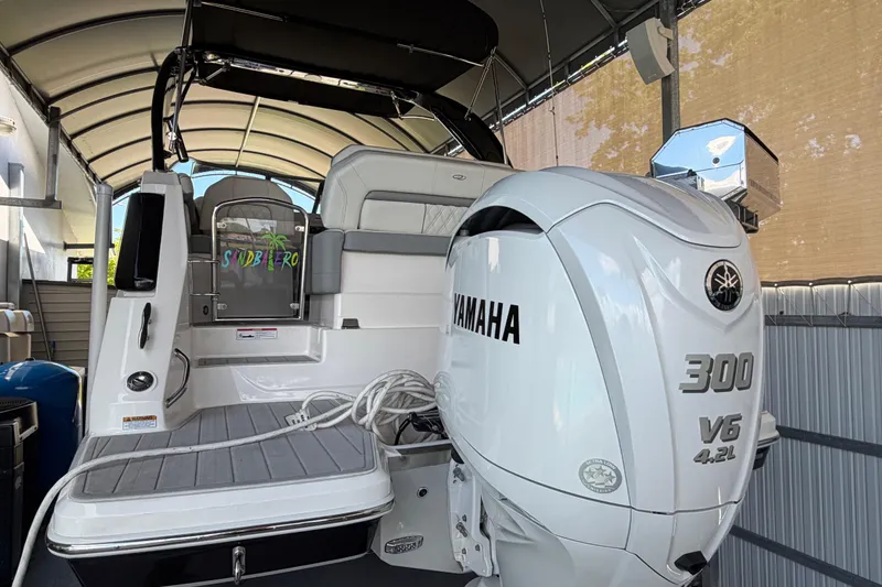 Slide: The Image of 2023 Regal 26 XO boat with Yamaha 300 V6 engine in covered storage. - 43
