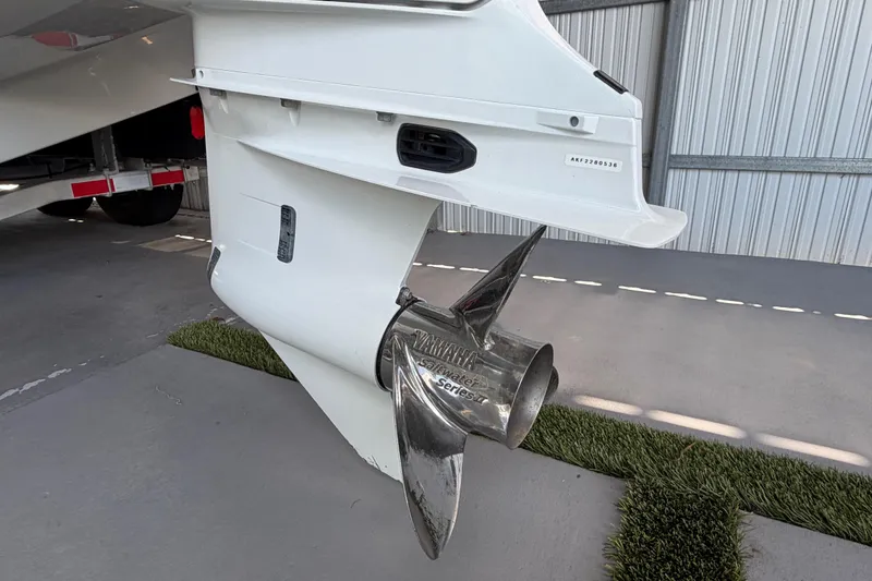 Slide: The Image of 2023 Regal 26 XO boat propeller and stern detail in a storage facility. - 45