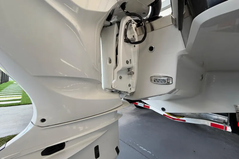 Slide: The Image of Close-up of 2023 Regal 26 XO boat's engine mount and hull details. - 47