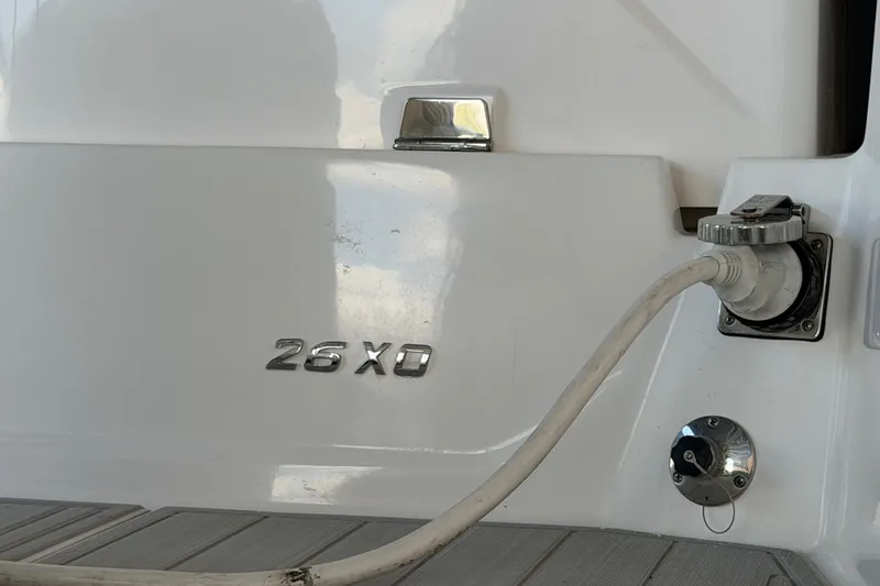 Slide: The Image of 2023 Regal 26 XO boat stern with power connection and model emblem. - 54