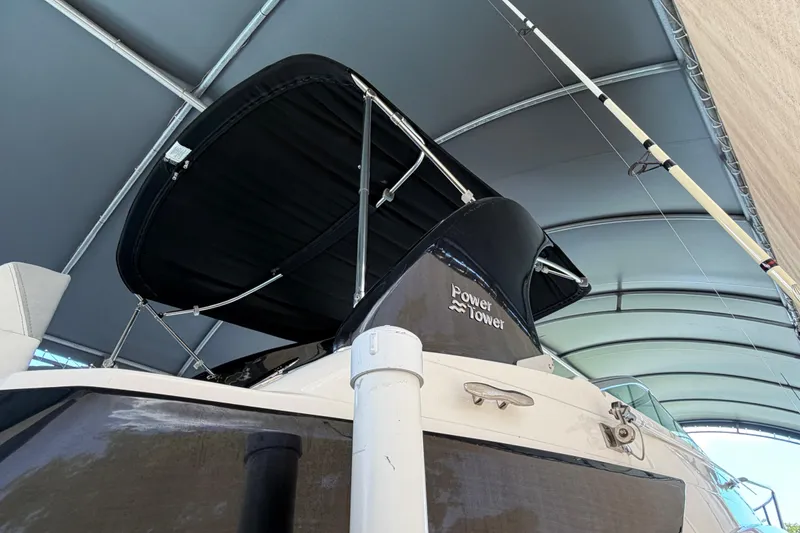 Slide: The Image of 2023 Regal 26 XO boat with Power Tower under a canopy. - 66