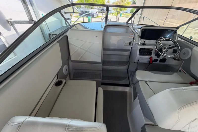 Slide: The Image of 2023 Regal 26 XO boat interior with modern helm and seating area. - 77