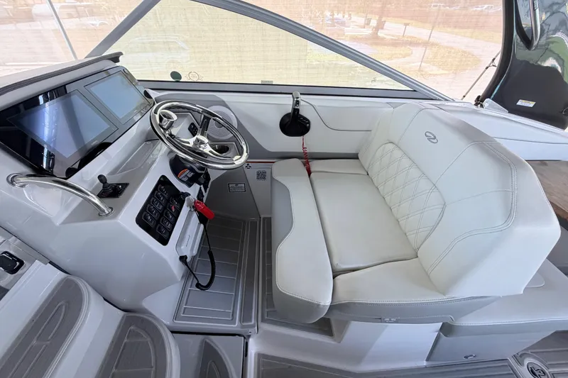 Slide: The Image of 2023 Regal 26 XO boat interior with modern helm and plush seating. - 86