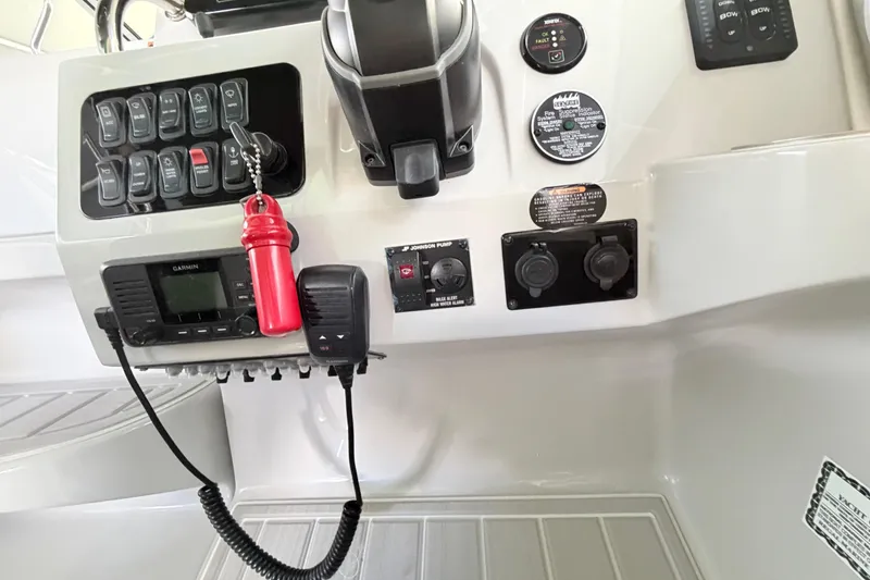 Slide: The Image of Control panel of 2023 Regal 26 XO boat with switches and navigation equipment. - 92