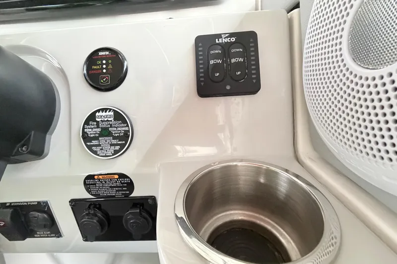 Slide: The Image of Control panel of 2023 Regal 26 XO boat with cup holder and speaker. - 93