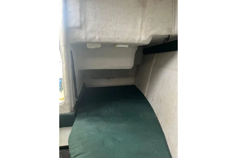 Slide: The Image of Interior cabin of 2006 Trophy 2359 Hardtop boat with green carpet. - 13