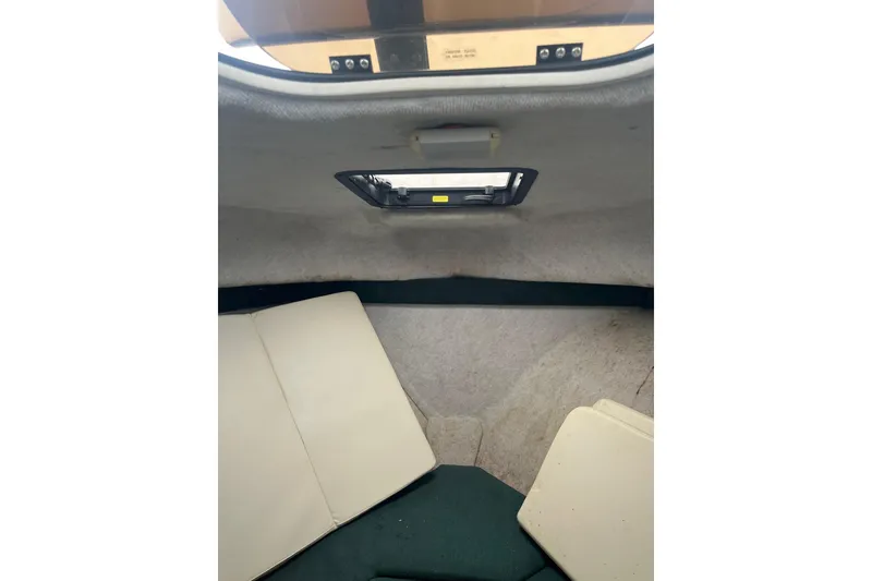 Slide: The Image of Interior cabin of 2006 Trophy 2359 Hardtop boat with cushions and hatch. - 15