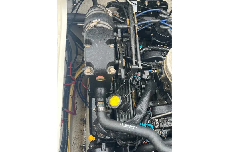 Slide: The Image of Engine compartment of a 2006 Trophy 2359 Hardtop boat, showcasing mechanical components. - 27