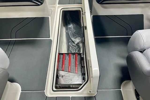 Slide: The Image of 2026 Bayliner V20i boat interior storage compartment with sleek design and ample space. - 10