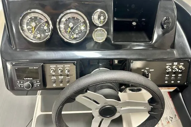 Slide: The Image of Steering console of 2026 Bayliner V20i boat with gauges and controls. - 5