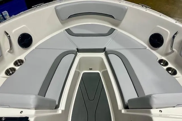 Slide: The Image of 2026 Bayliner V20i boat interior with gray seating and cup holders. - 6