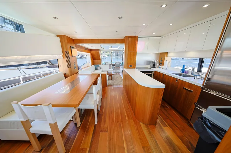 Slide: The Image of Luxurious interior of 2015 Sunseeker 75 Yacht with modern kitchen and dining area. - 10