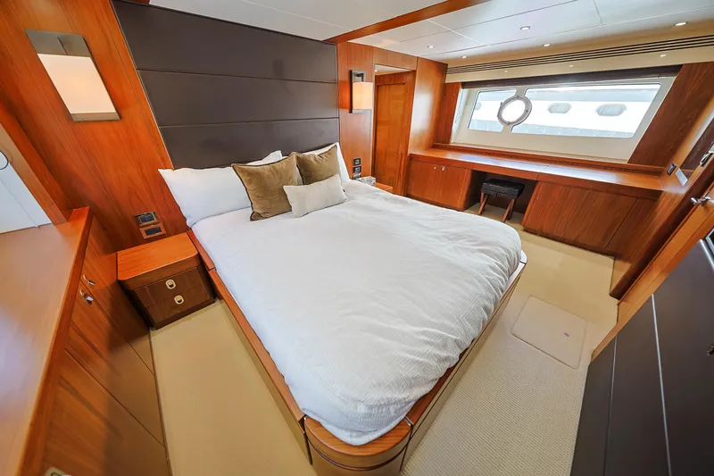 Slide: The Image of Luxurious bedroom interior of 2015 Sunseeker 75 Yacht with elegant wood finishes. - 12