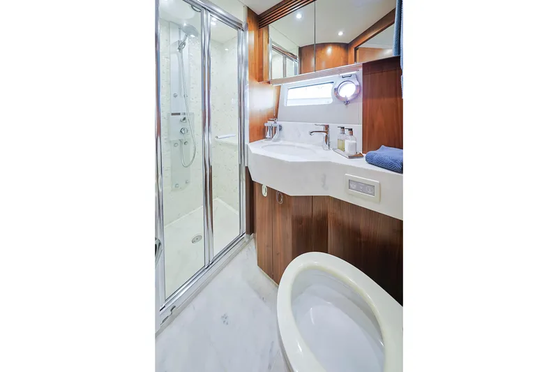 Slide: The Image of Luxurious bathroom in 2015 Sunseeker 75 Yacht with modern shower and elegant wood finishes. - 15
