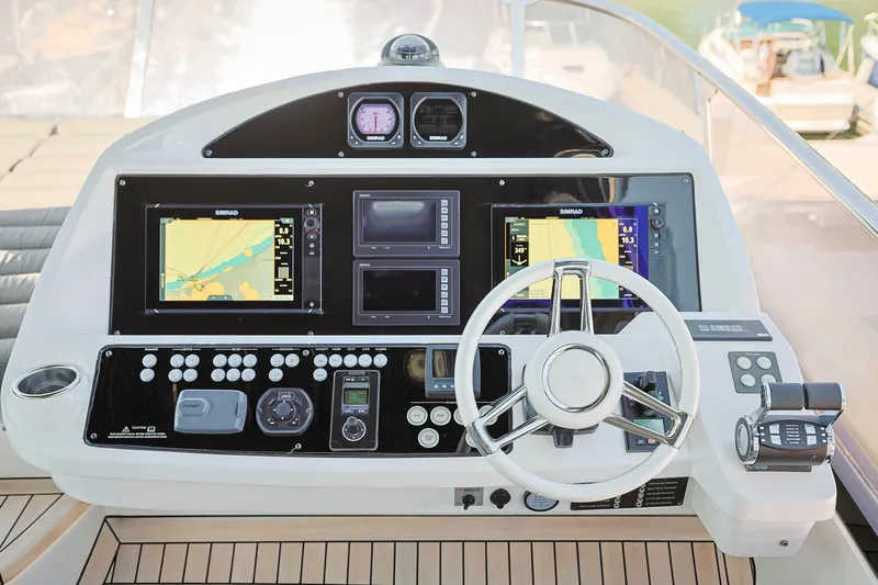 Slide: The Image of Cockpit of 2015 Sunseeker 75 Yacht with navigation screens and controls. - 5