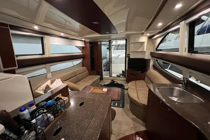 Slide: The Image of Interior of 2012 Meridian 341 Sedan yacht with sofa, TV, and kitchenette. - 12