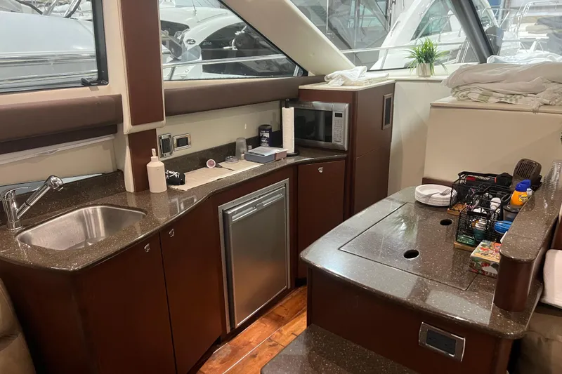 Slide: The Image of Luxurious interior of 2012 Meridian 341 Sedan yacht with plush seating and elegant decor. - 13