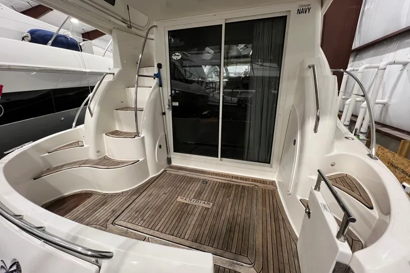 Slide: The Image of Cozy cabin interior of 2012 Meridian 341 Sedan yacht with bedding and storage. - 18