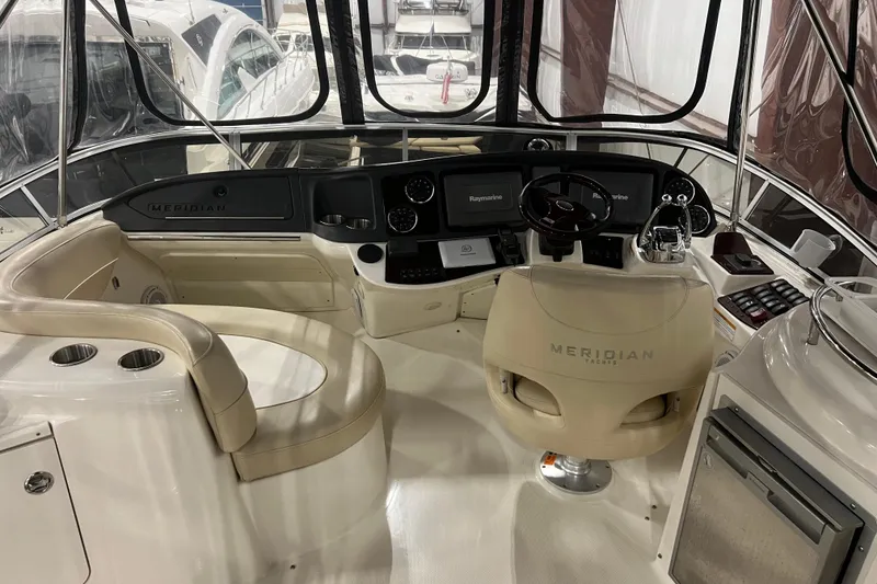 Slide: The Image of Interior of 2012 Meridian 341 Sedan yacht cockpit with steering wheel and navigation equipment. - 24