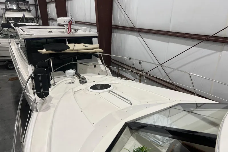 Slide: The Image of 2012 Meridian 341 Sedan yacht docked at marina under clear blue sky. - 4