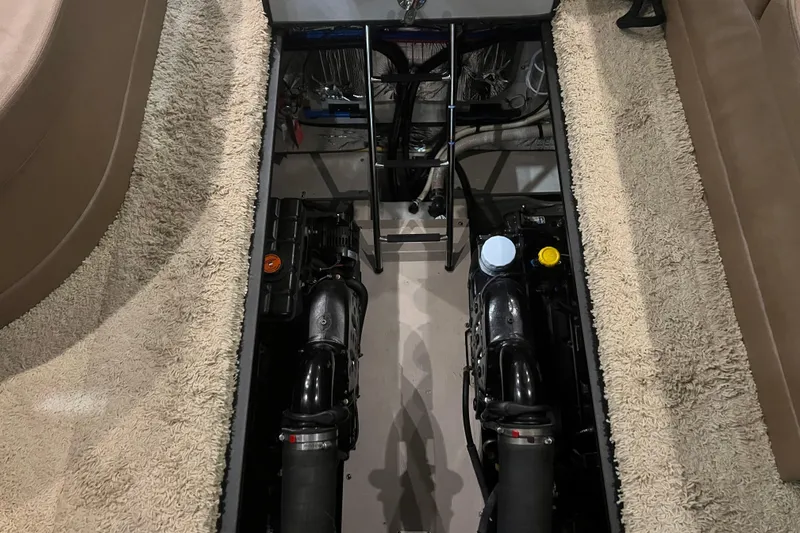 Slide: The Image of 2012 Meridian 341 Sedan yacht in indoor storage, showcasing sleek design and spacious deck. - 6