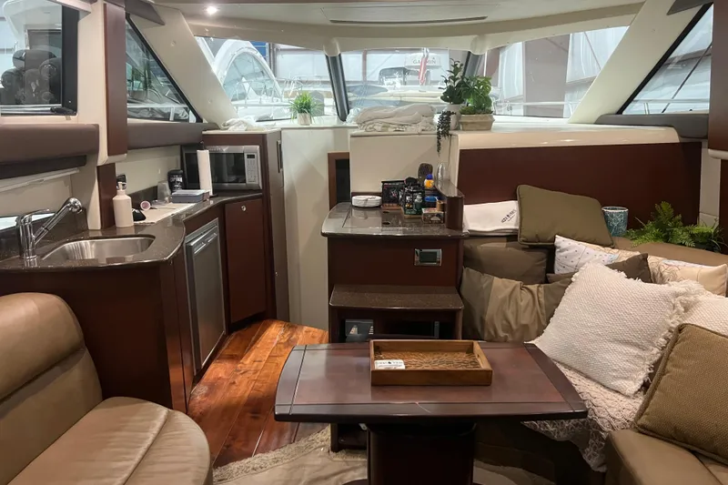 Slide: The Image of 2012 Meridian 341 Sedan yacht in storage, featuring sleek design and spacious cabin. - 7