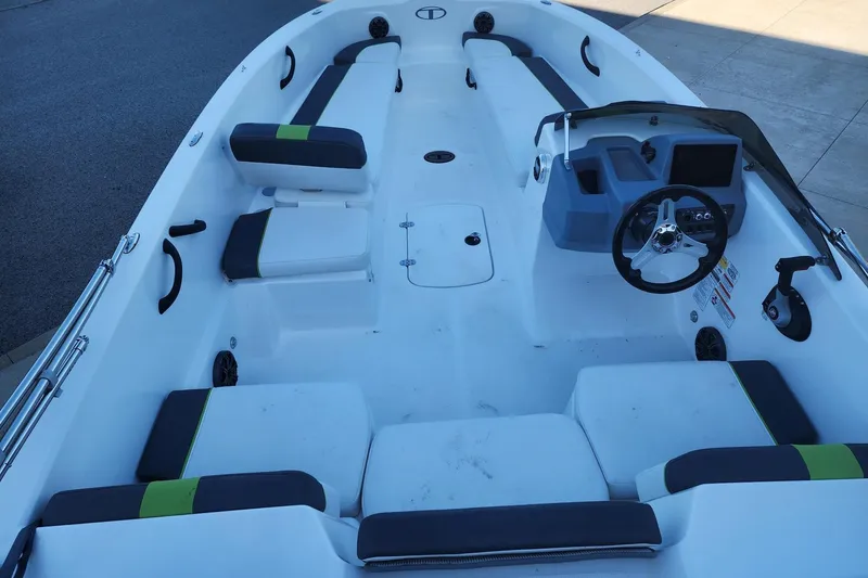 Slide: The Image of 2023 Tahoe T18 boat interior with seating, steering wheel, and dashboard. - 7