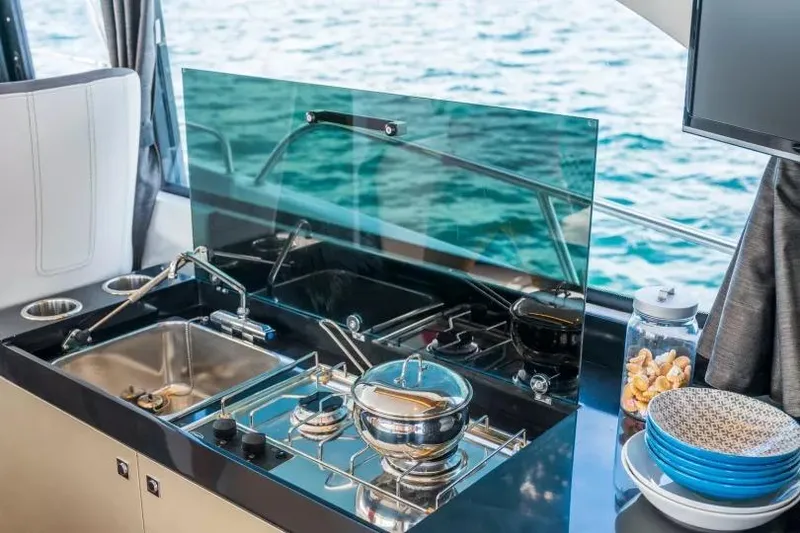 Slide: The Image of Modern kitchen on 2026 Beneteau Antares 11 yacht with ocean view. - 18