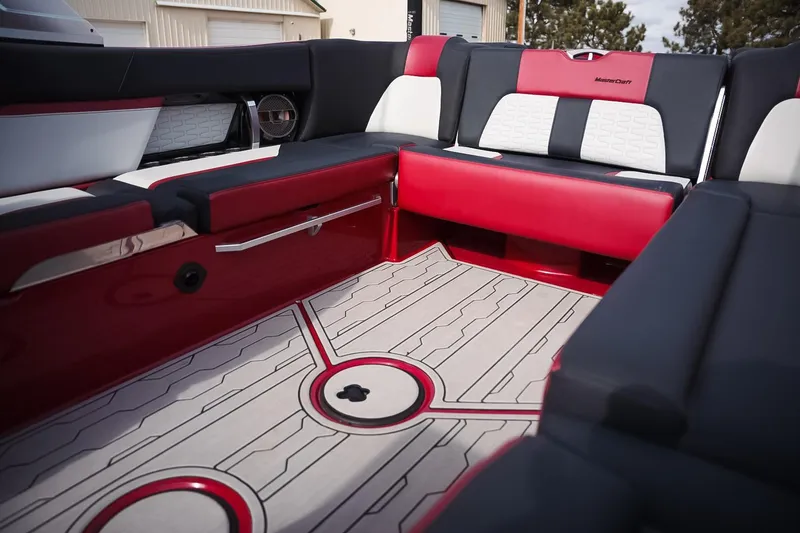 Slide: The Image of 2019 MasterCraft X24 boat interior with red and black seating and stylish flooring. - 14