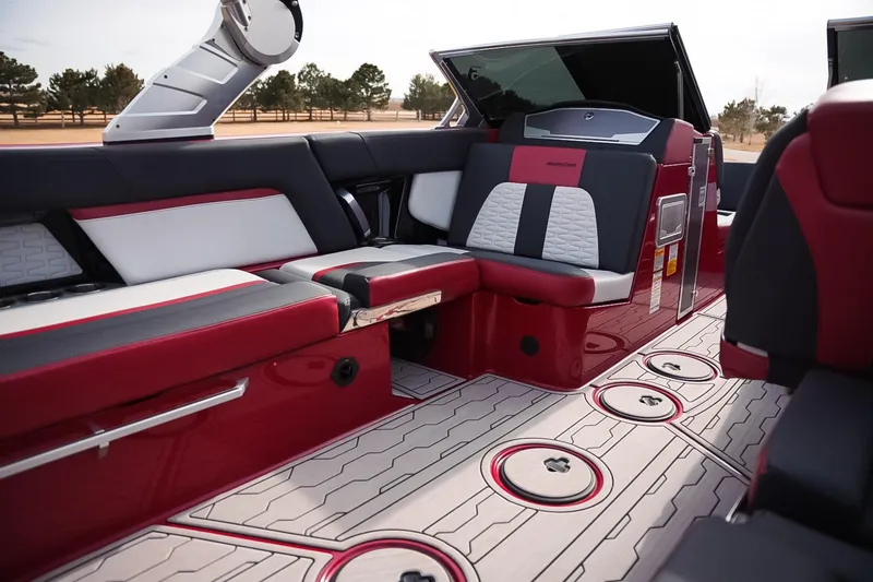 Slide: The Image of 2019 MasterCraft X24 boat interior with red and black seating, stylish design. - 16