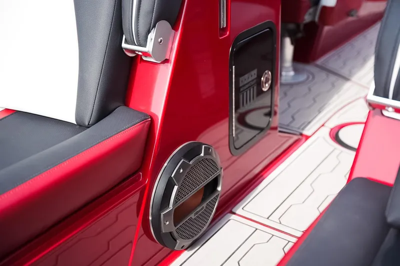 Slide: The Image of Interior of 2019 MasterCraft X24 boat with red accents and speaker system. - 23