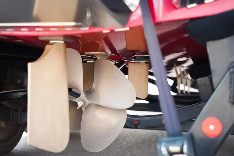 Slide: The Image of Close-up of 2019 MasterCraft X24 boat propeller and rudder system. - 24