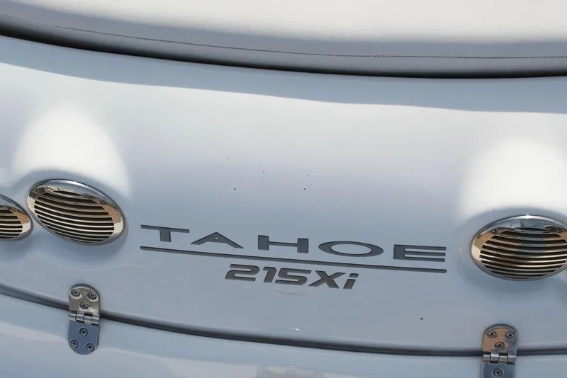 Slide: The Image of 2020 Tahoe 215 Xi boat rear view with logo and ventilation details. - 18