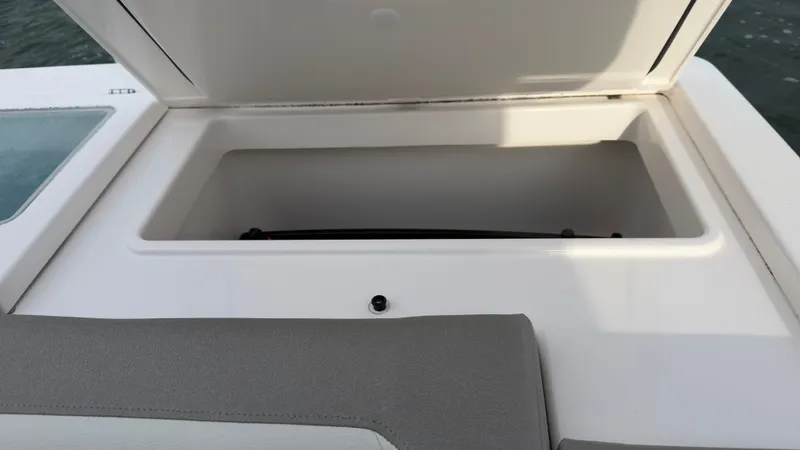 Slide: The Image of Open storage compartment on the 2024 Tiara Yachts 34 LS. - 34