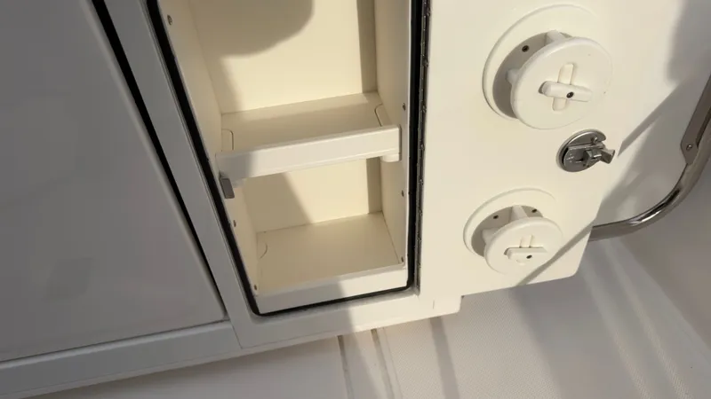 Slide: The Image of Interior of 2024 Tiara Yachts 34 LS with storage compartment. - 35