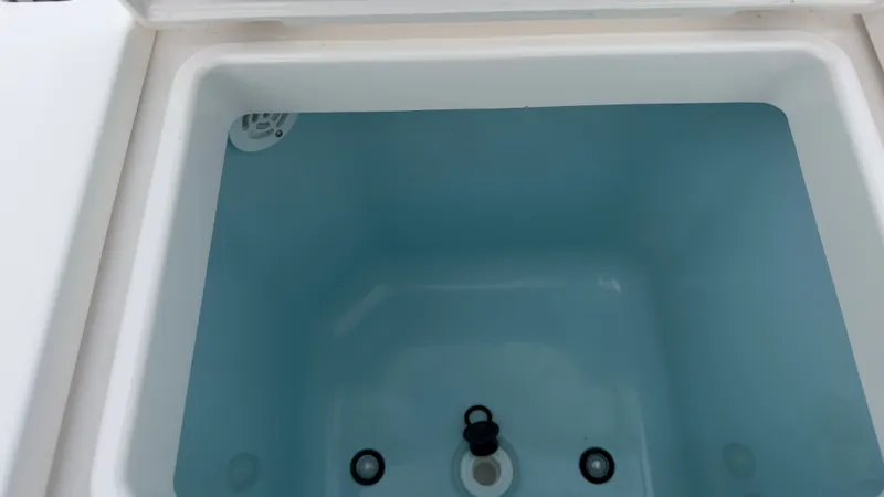 Slide: The Image of Interior view of 2024 Tiara Yachts 34 LS cooler compartment. - 36