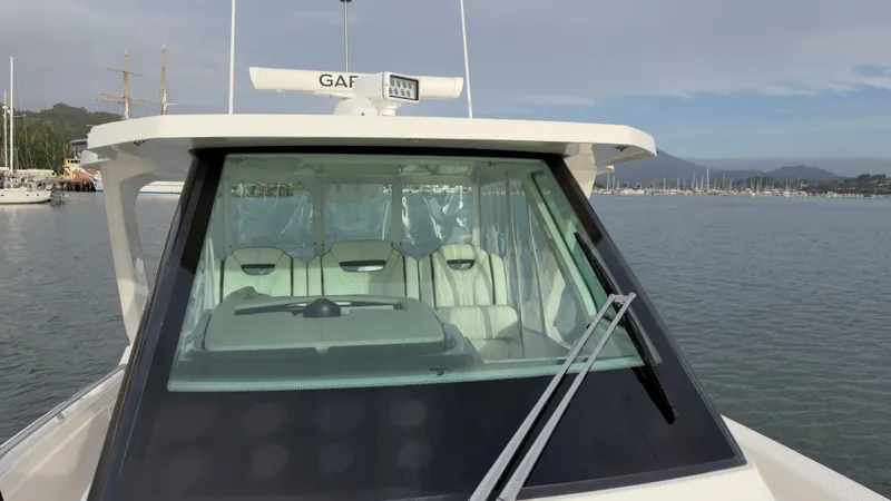 Slide: The Image of 2024 Tiara Yachts 34 LS on calm water, front view. - 37