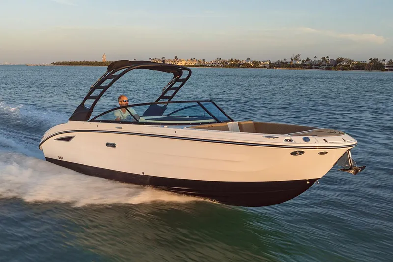 The Image of Manufacturer Provided Image: 2025 Sea Ray SDX 270 cruising on open water at sunset. - 0