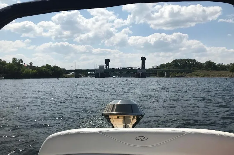 Slide: The Image of Boat view from a 2005 Regal 2750, approaching a bridge on a sunny day. - 7