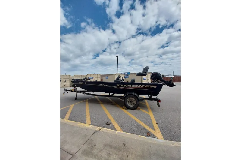 Slide: The Image of 2019 Tracker Pro Team 170 TX boat on trailer in parking lot. - 10