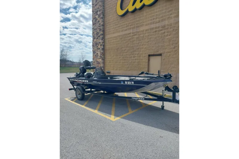 Slide: The Image of 2019 Tracker Pro Team 170 TX boat parked outside a store on a trailer. - 5