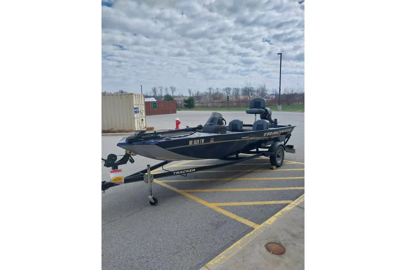 Slide: The Image of 2019 Tracker Pro Team 170 TX boat on trailer in parking lot. - 8
