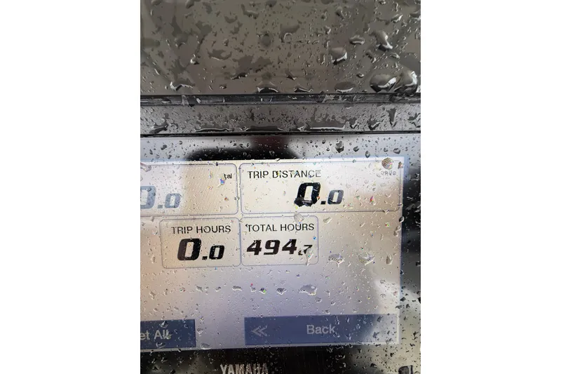 Slide: The Image of Display screen of a 2022 Cobia 220 Center Console boat showing trip data. - 15