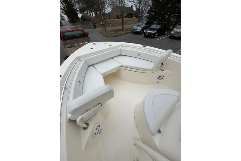 Slide: The Image of 2022 Cobia 220 Center Console boat with spacious seating and sleek design. - 16