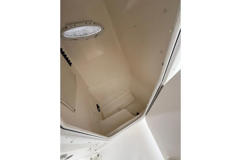 Slide: The Image of Interior view of 2022 Cobia 220 Center Console boat cabin. - 19